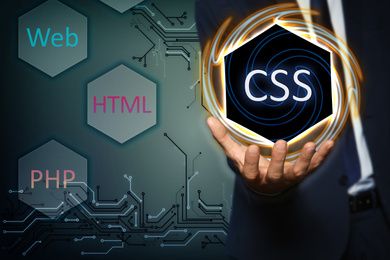 Web development. Man using button CSS on virtual screen, closeup 