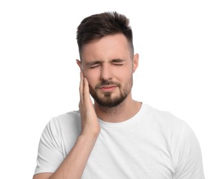 Photo of Young man suffering from ear pain on white background