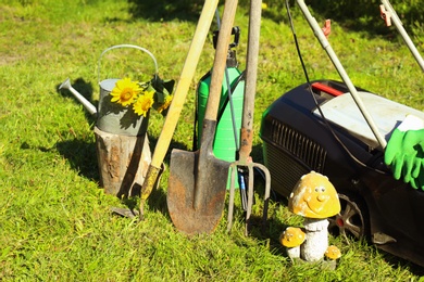 Set of gardening tools on grass outdoors