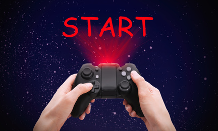 Woman with video game controller and word START against night sky, closeup