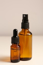 Bottles with oil on white table. Natural cosmetics