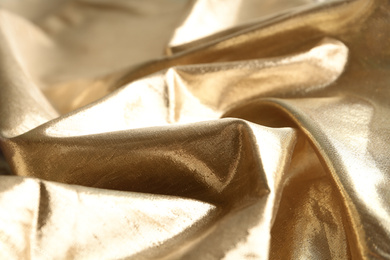 Texture of beautiful golden fabric as background, closeup