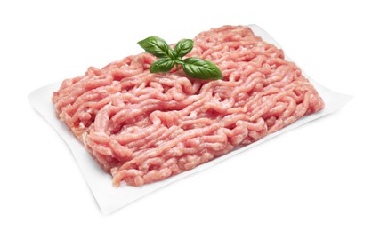 Raw chicken minced meat with basil on white background