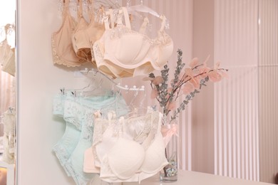 Luxury women's underwear on hangers in lingerie store
