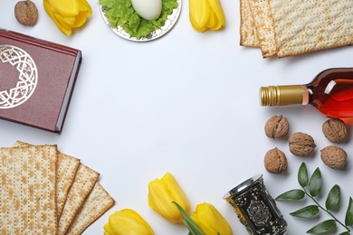 Flat lay composition with symbolic Passover (Pesach) items on white background, space for text