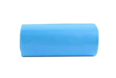 Roll of turquoise garbage bags on white background. Cleaning supplies