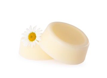 Solid shampoo bars and chamomile on white background. Hair care