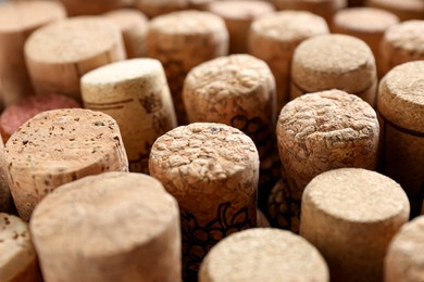Many corks of wine bottles as background, closeup