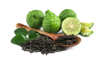 Dry bergamot tea leaves, wooden spoon and fresh fruits on white background