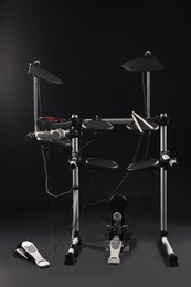 Modern electronic drum kit on dark background. Musical instrument