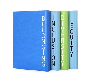 Colorful hardcover books with words Belonging, Diversity, Equity, Inclusion on white background