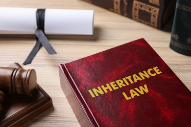 Inheritance law book on wooden table, closeup