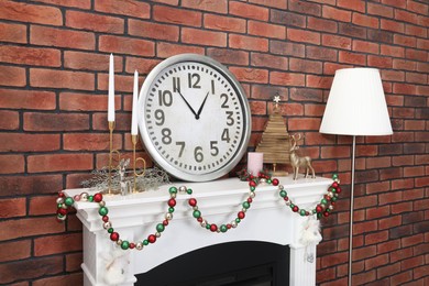 Photo of Modern fireplace decorated for Christmas in living room