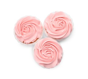 Photo of Baby shower cupcakes with pink cream on white background, top view