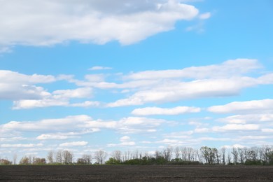 Photo of Picturesque view of agricultural field on cloudy day