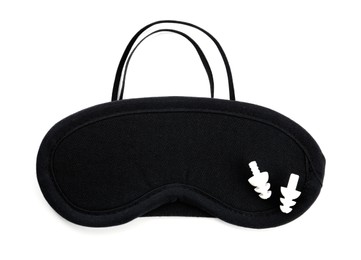 Pair of ear plugs and black sleeping mask on white background, top view