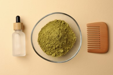 Photo of Henna powder, bottle of liquid and comb on beige background, flat lay. Natural hair coloring