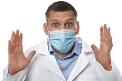 Photo of Doctor with protective mask feeling fear on white background