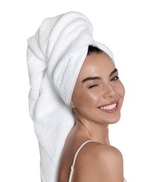 Beautiful young woman with towel on head against white background