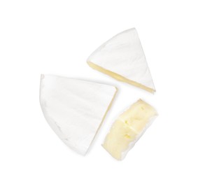 Tasty cut brie cheese on white background, top view