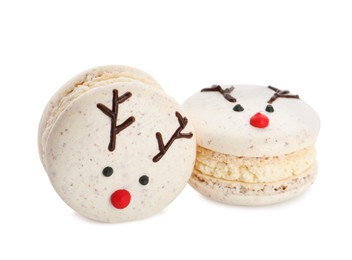 Delicious Christmas reindeer macarons on white background