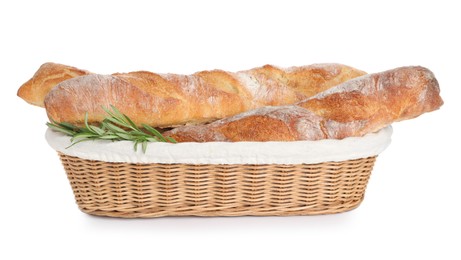 Crispy French baguettes with rosemary in wicker basket on white background. Fresh bread
