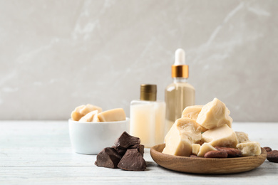 Organic cocoa butter on white wooden table