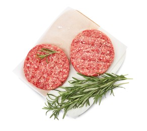 Raw hamburger patties with rosemary and salt on white background, top view