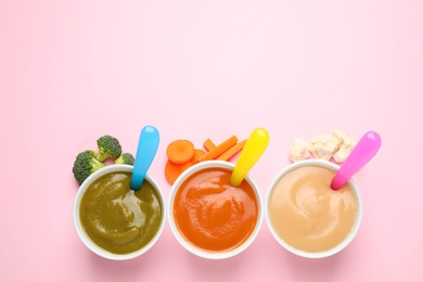 Healthy baby food and ingredients on pink background, flat lay. Space for text