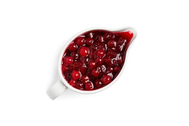 Cranberry sauce in pitcher isolated on white, top view