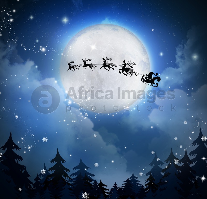Image of Magic Christmas eve. Santa with reindeers flying in sky on full moon night
