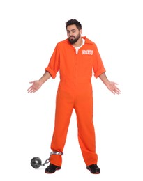 Prisoner in jumpsuit with metal ball perplexedly shrugging his shoulders on white background