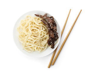 Tasty cooked rice noodles with meat and chopsticks isolated on white, top view