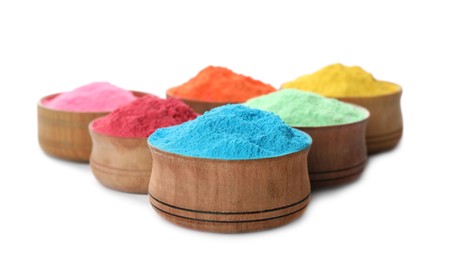 Colorful powder dyes in bowls on white background. Holi festival