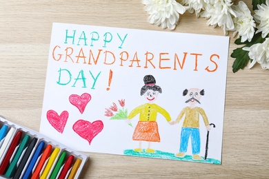 Beautiful drawing on wooden table, flat lay. Happy Grandparents Day