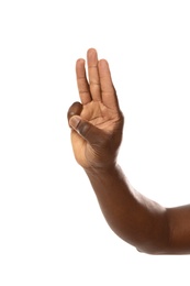 African-American man showing hand gesture on white background, closeup