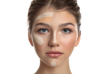 Photo of Beautiful girl on white background. Using concealer and foundation for face contouring