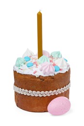 Photo of Traditional Easter cake with meringues, candle and painted egg on white background
