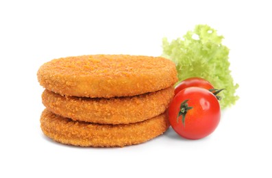 Uncooked breaded cutlets, tomatoes and lettuce on white background. Freshly frozen semi-finished product
