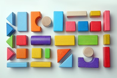 Colorful wooden construction set on white background top view