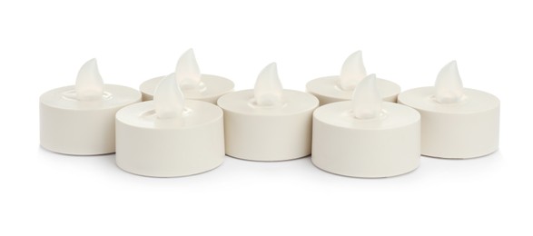 Decorative flameless LED candles on white background