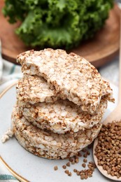 Stack of crunchy buckwheat cakes on plate, closeup