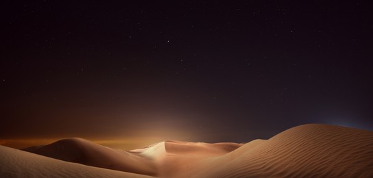 Image of Scenic view of sandy desert under starry sky in night. Banner design
