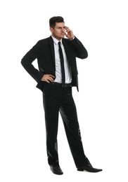 Thoughtful businessman in formal suit on white background