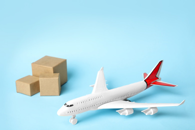 Toy plane on blue  background. Logistics and wholesale concept
