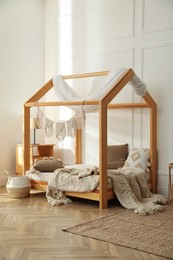 Stylish child room interior with house bed