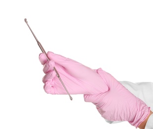 Doctor in sterile gloves holding medical instrument on white background
