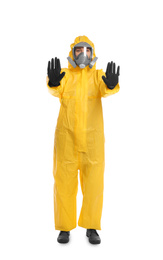 Woman in chemical protective suit making stop gesture on white background. Virus research