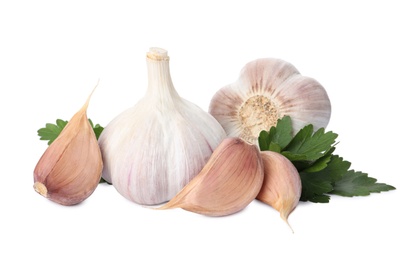 Fresh garlic bulbs and cloves with parsley on white background. Organic food