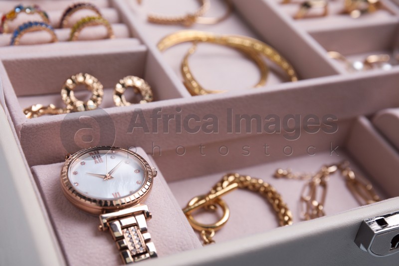 Jewelry box with stylish golden bijouterie, closeup view